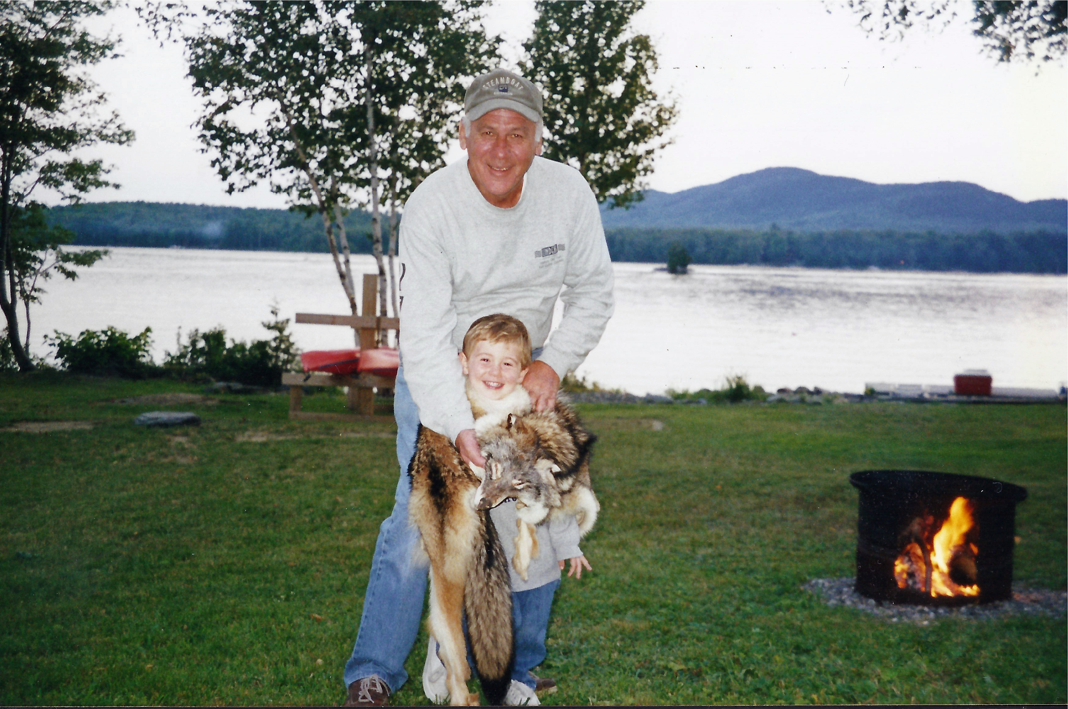 Lakeside family moment with grandson and dog