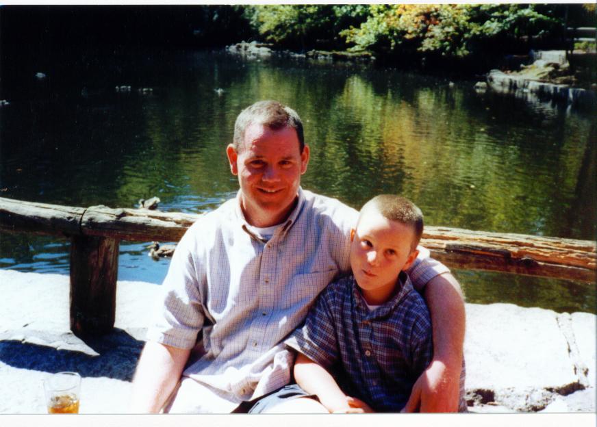 Father and son by the pond - a cherished family memory
